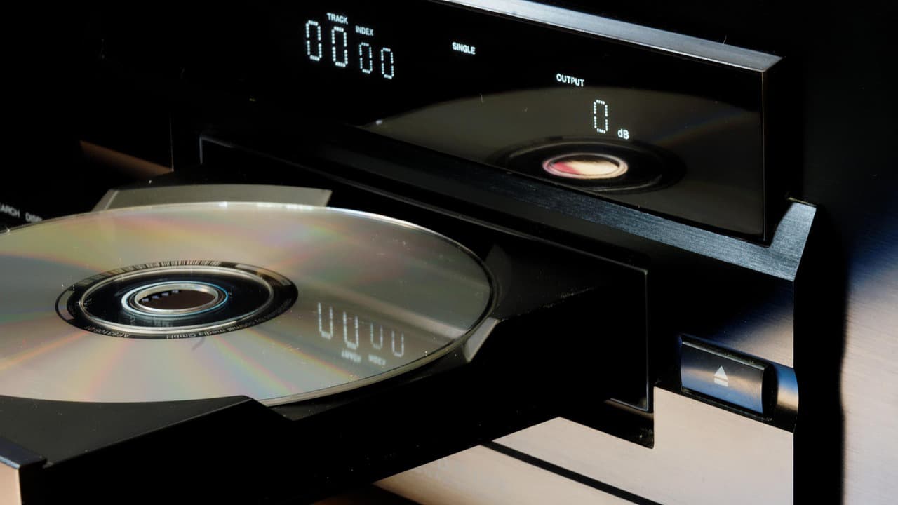 A CD player with a compact disc in the tray