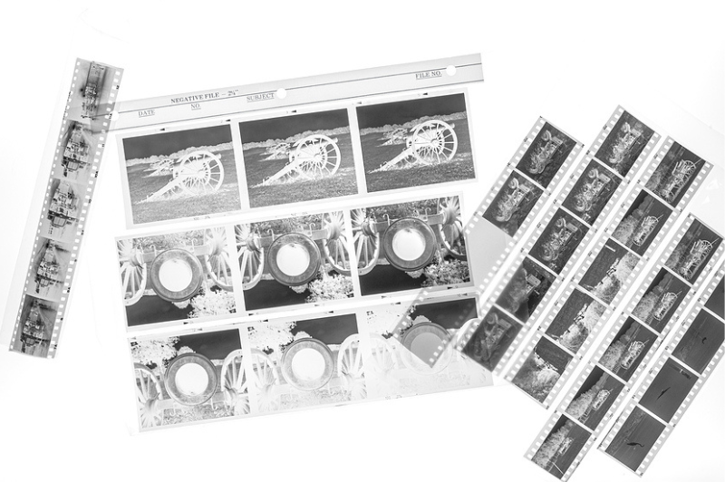 Film negatives in various formats including 35mm, medium format, and APS, representing professional negative scanning services by DVD Your Memories in Southern California.