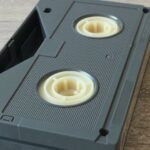 Closeup of an upside down Betamax video tape on a wooden surface