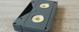 Closeup of an upside down Betamax video tape on a wooden surface