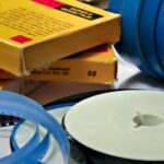 A collection of 8mm film that has been taken out of storage and laid out.