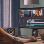 Someone editing old home movies on their computer.