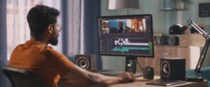 Someone editing old home movies on their computer.