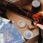 Someone looking through an old photo box and finding canisters of negatives.