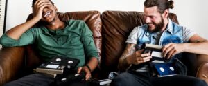 Two people reminisce and look at old family video tapes together.