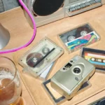 A pile of cassettes and a cassette player.