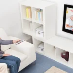People on a couch watching a digitized home movie