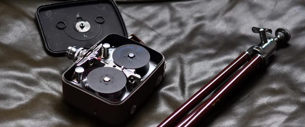 An 8mm film recorder that fell and broke open, possibly damaging the film.